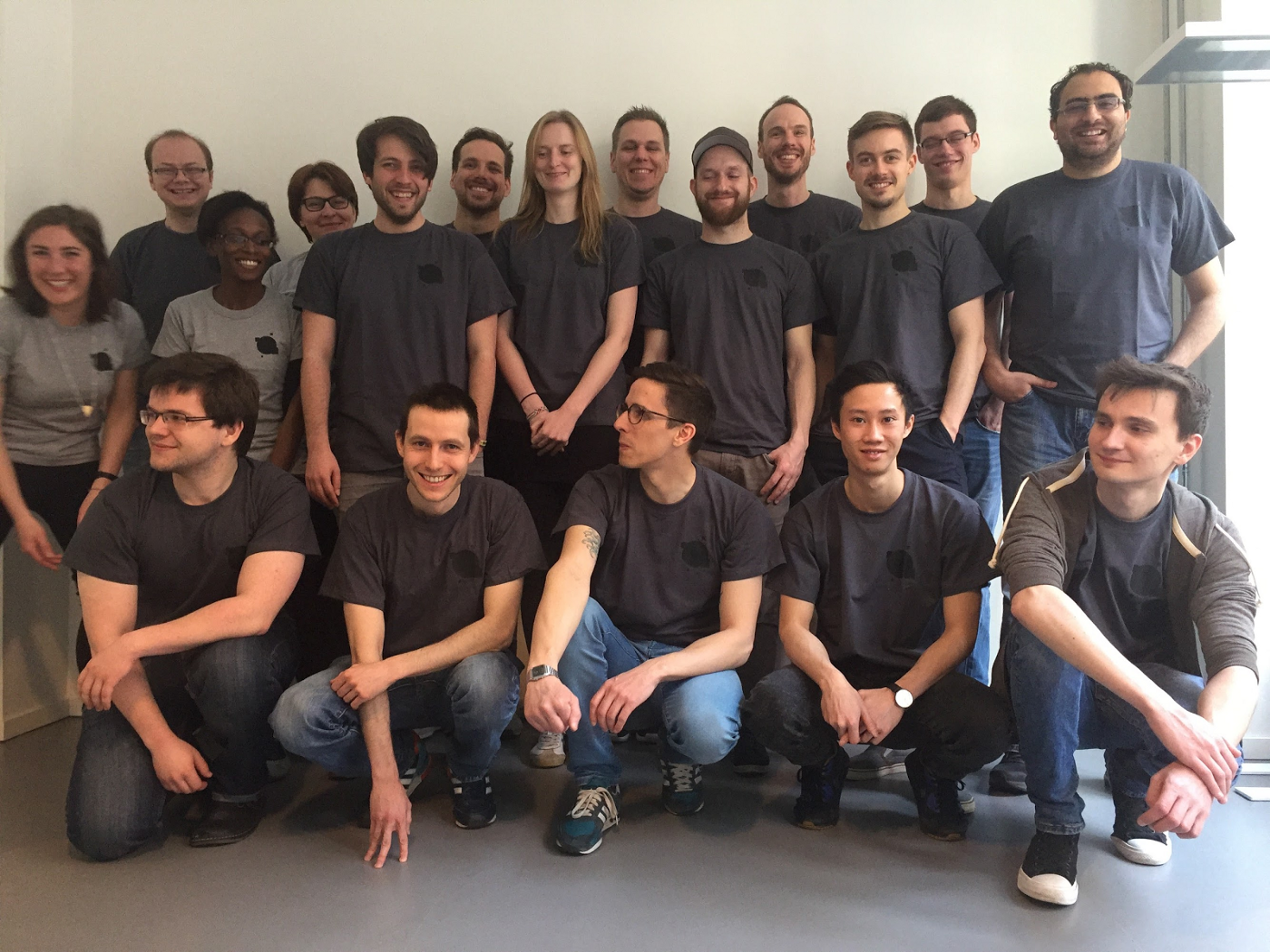 Tired, but smiling, hackathon participants pose for a group photo.